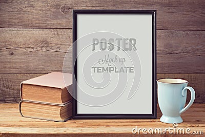 Poster mock up template with old books and coffee cup Stock Photo