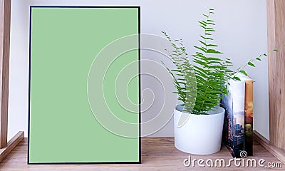 Poster mockup with plant and books Stock Photo
