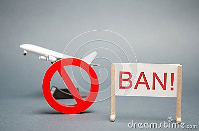 A poster with the word Ban. The sign of the ban and a miniature toy aircraft. Ban on flights of civil aircraft. Forbidden zone. Stock Photo