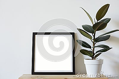 Posters square format in black frame in white stylish modern interior on shelf, living room. Design template mockup Stock Photo