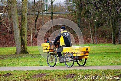 A postman delivers his freight. Editorial Stock Photo