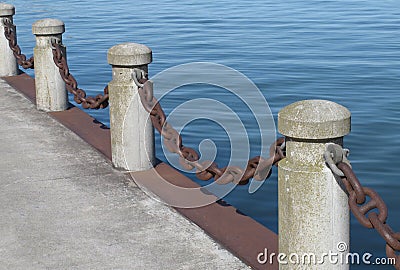 Posts and chain on a pier Stock Photo