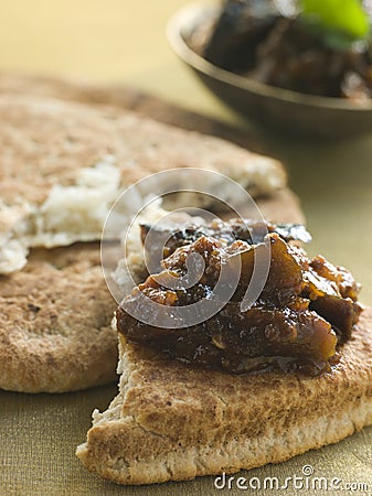 Pot of Brinjal Chutney with Naan Bread Stock Photo