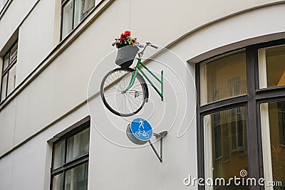 Pot with flowers in form of bicycle. Bicycle with flowers creative design city urbanism Stock Photo