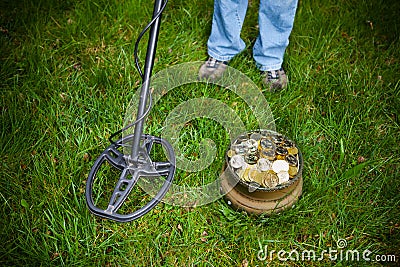 Pot of golden coins collected with metal detector Stock Photo