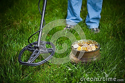 Pot of golden coins collected with metal detector Stock Photo
