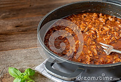 Pot with ragout on wooden background with sopy space Stock Photo