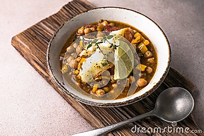 Potaje de vigilia - Chickpea stew with spinach and cod. Typical spanish food for Easter holidays. Chickpea stew with spinach Stock Photo