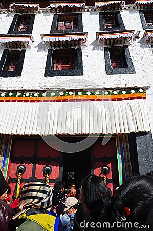 Potala Palace with Pilgrims Editorial Stock Photo