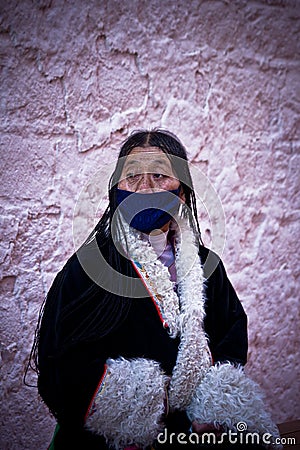 Potala Palace Tibetan Devotee in a coat, Lhasa, Tibet Editorial Stock Photo