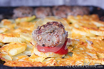 potato baked in the oven with a chop Stock Photo