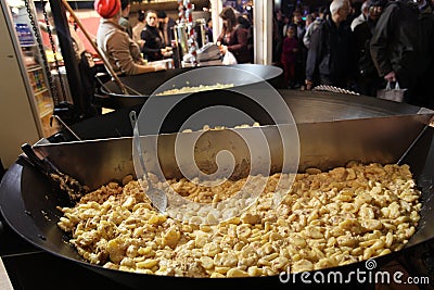 Potato with cream in street food market. Paris Editorial Stock Photo
