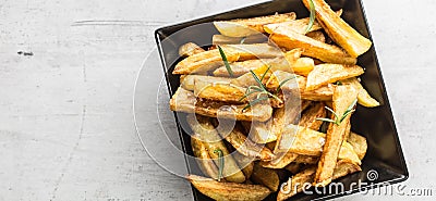 Potato Fries. Homemade potato fries with salt and rosemary Stock Photo