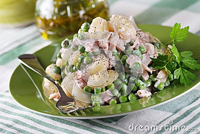 Potato gnocchi with ham and peas Stock Photo