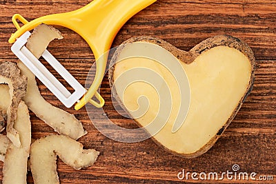 Potato heart over wooden background Stock Photo