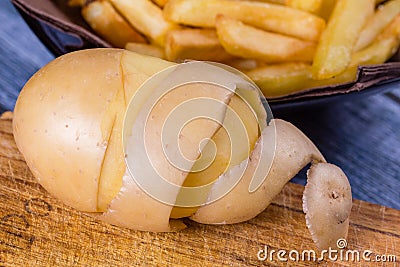 Potato peeled and cutted by hand Stock Photo