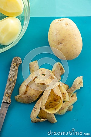 Potato Peelings on a Blue Background Stock Photo