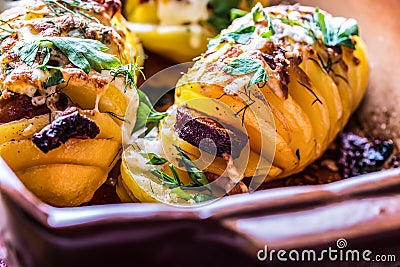 Potato.Roasts potatoes. Home cooking roasts potatoes. Baking pan full of baked potatoes stuffed with bacon sausage onions Stock Photo