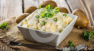 Potato salad with yoghurt and mayonnaise dressing with chives. Stock Photo