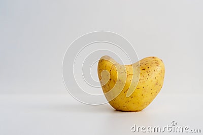 Potato in the shape of a heart. Stock Photo