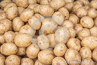 Potatoes close up detailed fresh off the ground in a basket on a Sunday`s farmers market. Concept for homegrown farming vegetarian Stock Photo