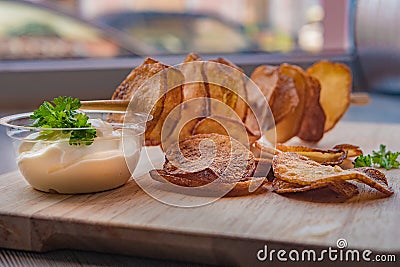 Potatoes cut into slices, on a stick Stock Photo