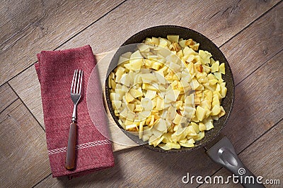 Potatoes fried in a pan, rustic style, Stock Photo