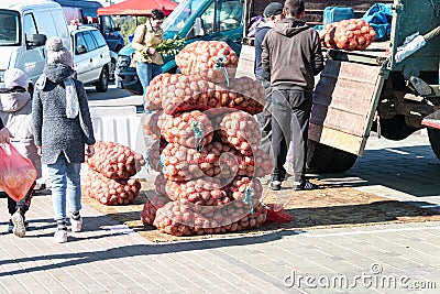 Minsk. Belarus.10.10.2021. Potatoes in mesh bags for sale at the farmers' market. Editorial Stock Photo