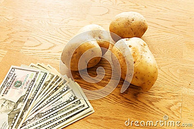 Potatoes and money Stock Photo