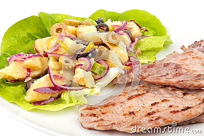 Potatoes salad with grilled meat Stock Photo