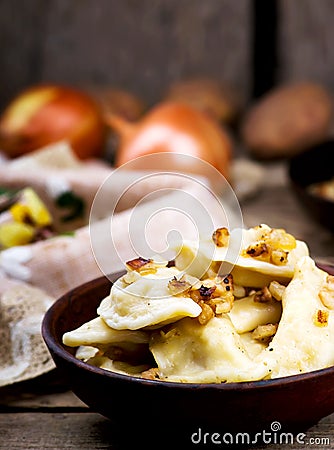 Potatoes vareniki in a ceramic bowl. Stock Photo