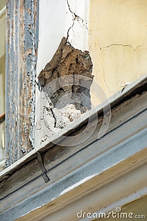 Pothole in the facade of a vintage building is close Stock Photo