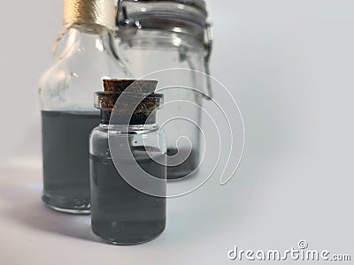 Potions with gray liquid. Alchemy set with flasks. small glass bottles with colored liquid for game role play. magic potions with Stock Photo