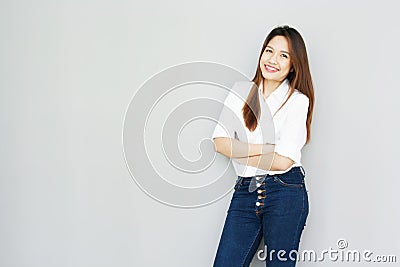 potrait Asian lady smile in casual suite White Shirt and blue jeans Stock Photo