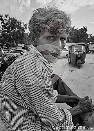 A Potrait Indian Man Sitting at Parking Place Editorial Stock Photo