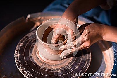 Pottery girl sculpts from clay. Handmade products. Close-up. Stock Photo