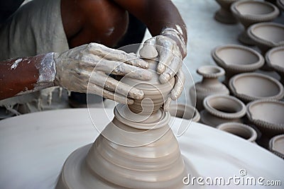 Potter making diyas clay lamps before diwali festival Stock Photo