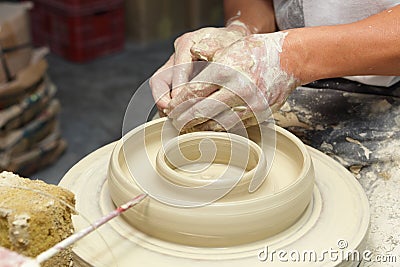 Potter shaping clay in pottery Stock Photo