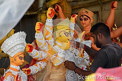 The potters of Kolkata are preparing idols of Goddess Devi Durga and paint those for Durga Puja festival, biggest religious Editorial Stock Photo