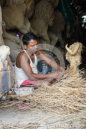 The potters of Krishnanagar are preparing idols of Goddess Devi Durga and paint those for Durga Puja festival, biggest religious Editorial Stock Photo