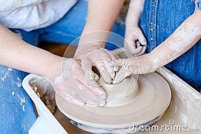 Pottery handcraft hobby hands shape clay wheel Stock Photo