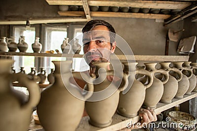 Pottery manufacturing , traditional handcraft workers in Romanian village of Horezu , Unesco heritage Editorial Stock Photo