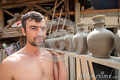 Pottery manufacturing , traditional handcraft workers in Romanian village of Horezu , Unesco heritage Editorial Stock Photo