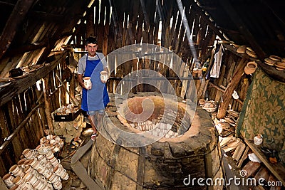 Pottery manufacturing , traditional handcraft workers in Romanian village of Horezu , Unesco heritage Editorial Stock Photo