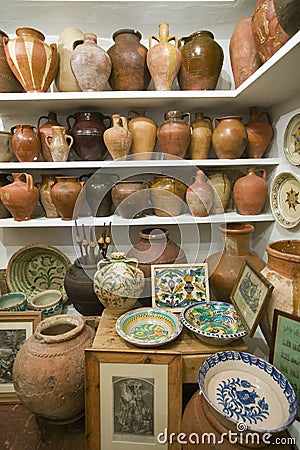 Pottery store shows stacks of old pots in old part of Centro, Sevilla Spain Editorial Stock Photo
