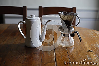 pour over coffee handmade brewing at home on natural wooden table natural light Stock Photo
