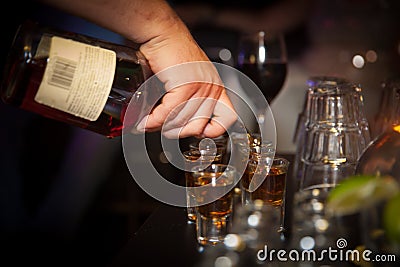 Pouring alcohol Stock Photo