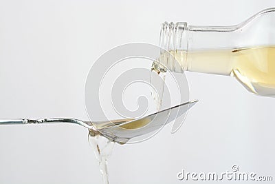 Pouring apple cider vinegar Stock Photo