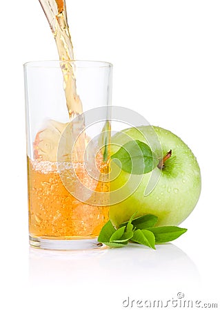 Pouring apple juice into a glass, green apples Stock Photo