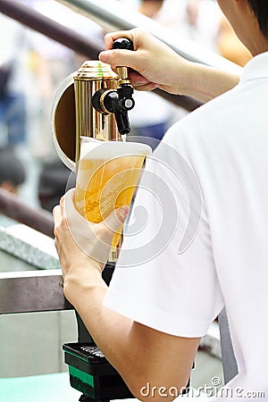 POURING BEER Stock Photo